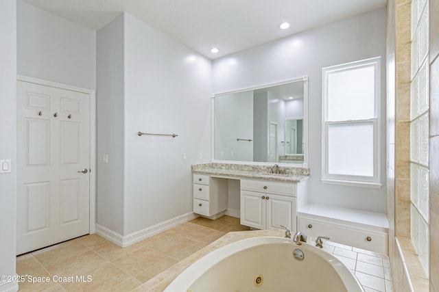 4117 Melrose Ct, Melbourne, FL 32940 - full bathroom with a tub with jets, vanity, tile patterned floors, and recessed lighting