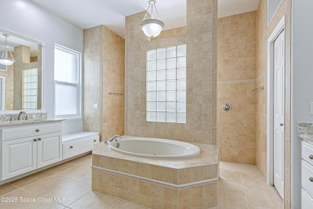 4117 Melrose Ct, Melbourne, FL 32940 - full bath with tile patterned floors, tile walls, a bath, and vanity
