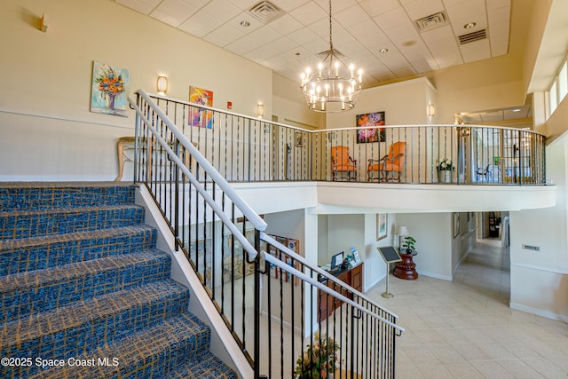 4117 Melrose Ct, Melbourne, FL 32940 - stairway with tile patterned floors, a chandelier, and visible vents