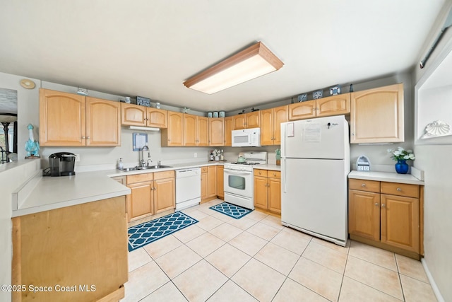 kitchen featuring light tile patterned floors, light brown cabinets, a sink, and white appliances