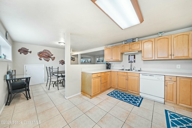 kitchen featuring light countertops, dishwasher, light brown cabinetry, and light tile patterned floors