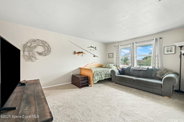 carpeted bedroom with baseboards