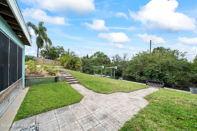 view of yard featuring a sunroom