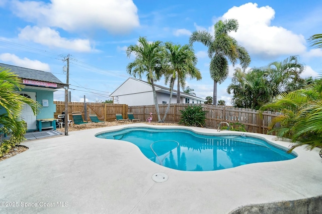 view of pool with a fenced backyard, a patio, and a fenced in pool