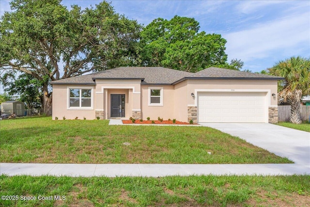 958 Chace Ln NE, Palm Bay, FL 32905 - prairie-style home with stone siding, an attached garage, concrete driveway, and stucco siding