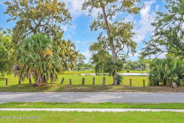 958 Chace Ln NE, Palm Bay, FL 32905 - view of home's community featuring a water view and a yard