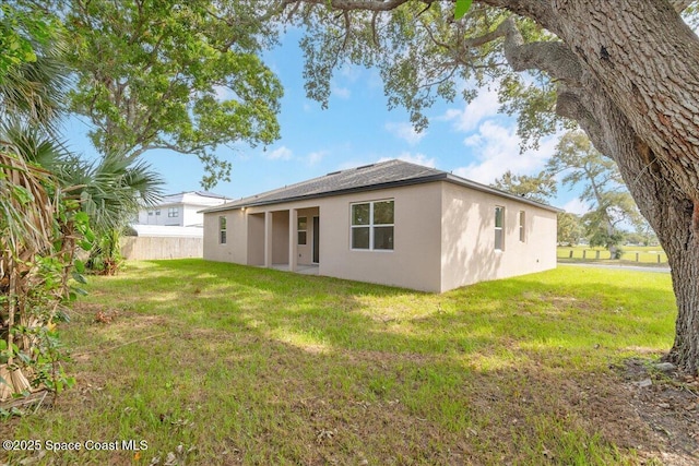 958 Chace Ln NE, Palm Bay, FL 32905 - back of property with stucco siding