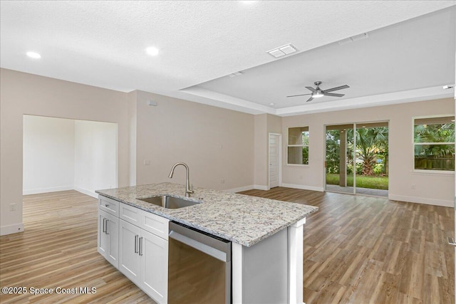 958 Chace Ln NE, Palm Bay, FL 32905 - kitchen with dishwasher, light wood-type flooring, ceiling fan, open floor plan, and light stone countertops