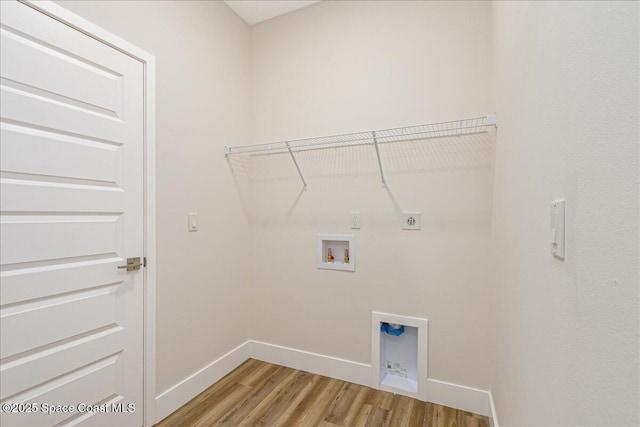 958 Chace Ln NE, Palm Bay, FL 32905 - laundry room with hookup for an electric dryer, light wood-type flooring, and hookup for a washing machine