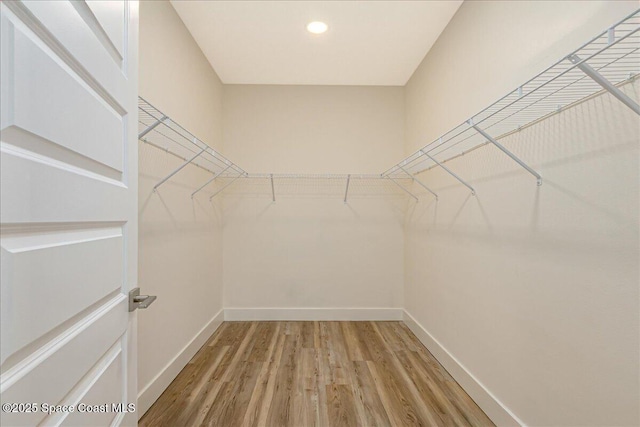 958 Chace Ln NE, Palm Bay, FL 32905 - spacious closet featuring wood finished floors