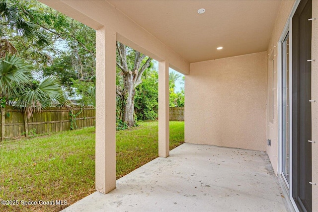 958 Chace Ln NE, Palm Bay, FL 32905 - fenced backyard featuring a patio