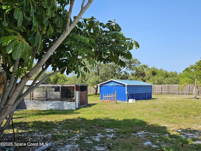 view of yard featuring an outbuilding and exterior structure