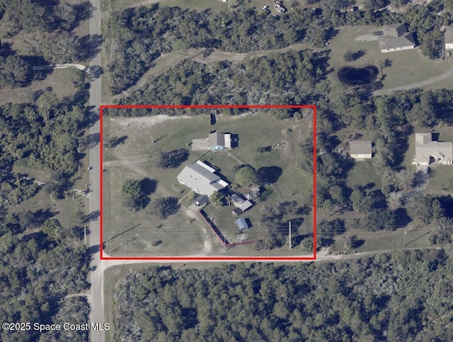 aerial map of property and surrounding area featuring property parcel outlined