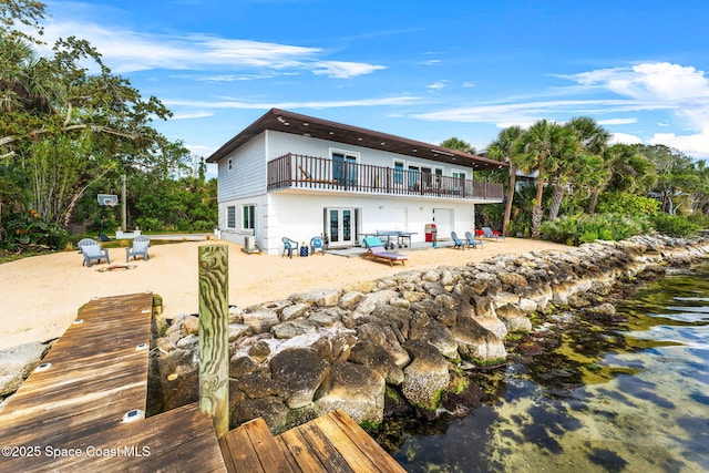 860 S Banana River Dr, Merritt Island, FL 32952 - back of property featuring a patio, french doors, and a deck
