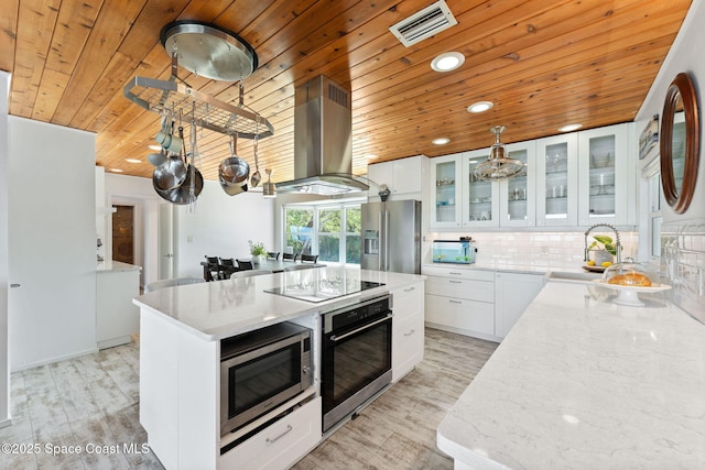 860 S Banana River Dr, Merritt Island, FL 32952 - kitchen featuring visible vents, extractor fan, wood ceiling, a sink, and appliances with stainless steel finishes