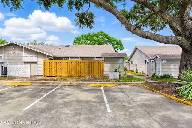 uncovered parking lot with fence