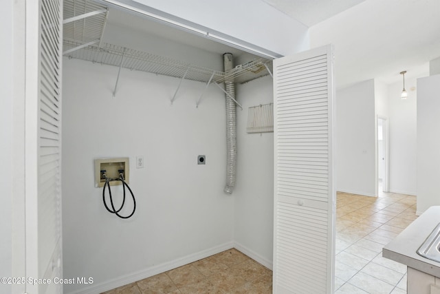 laundry room with washer hookup, laundry area, electric dryer hookup, baseboards, and light tile patterned flooring