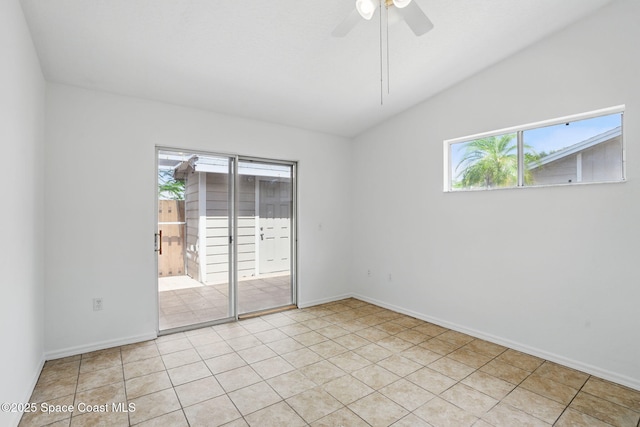 spare room with plenty of natural light, baseboards, ceiling fan, and vaulted ceiling