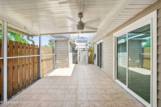 view of patio / terrace featuring fence and a ceiling fan