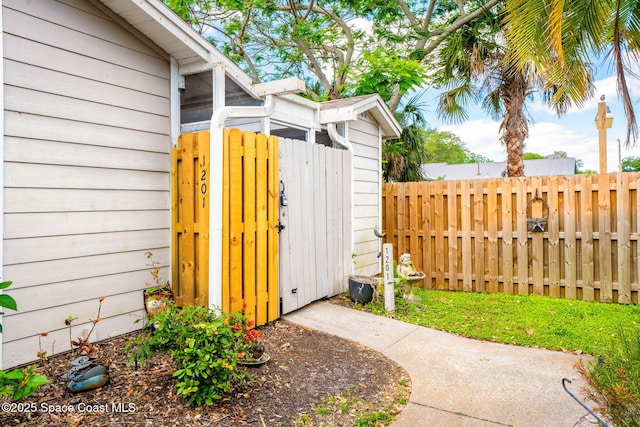 exterior space featuring fence and a gate