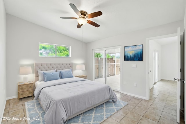 bedroom with access to outside, baseboards, light tile patterned floors, and vaulted ceiling