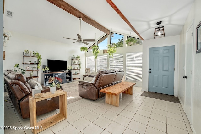 6010 Flamingo Ave, Cocoa, FL 32927 - living room with vaulted ceiling with beams, a ceiling fan, visible vents, and light tile patterned flooring