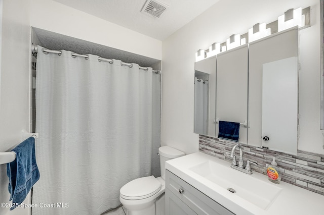 6010 Flamingo Ave, Cocoa, FL 32927 - full bathroom featuring toilet, tasteful backsplash, visible vents, a shower with shower curtain, and vanity