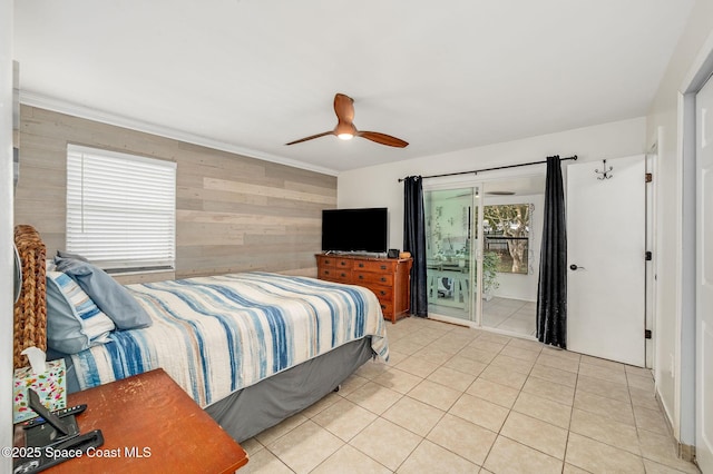 6010 Flamingo Ave, Cocoa, FL 32927 - bedroom with wood walls, a ceiling fan, and tile patterned floors