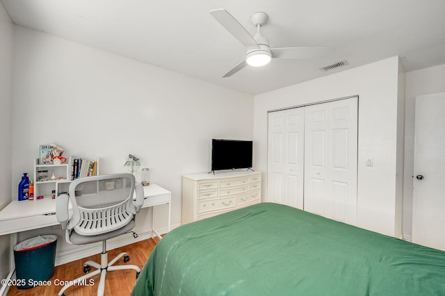 6010 Flamingo Ave, Cocoa, FL 32927 - bedroom with a ceiling fan, wood finished floors, visible vents, and a closet