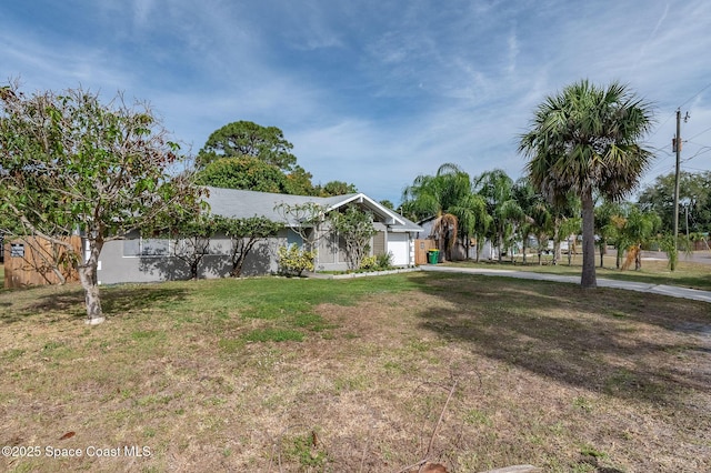 6010 Flamingo Ave, Cocoa, FL 32927 - view of yard featuring a garage