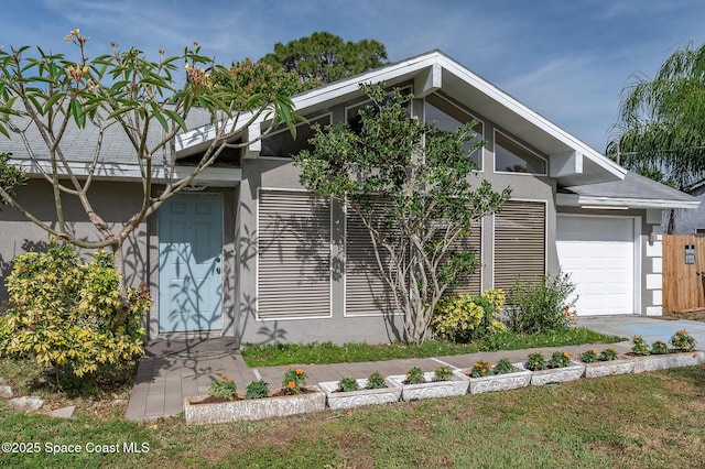 6010 Flamingo Ave, Cocoa, FL 32927 - view of front facade with stucco siding and an attached garage