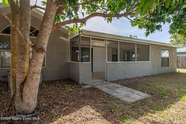 6010 Flamingo Ave, Cocoa, FL 32927 - exterior space featuring a sunroom and stucco siding
