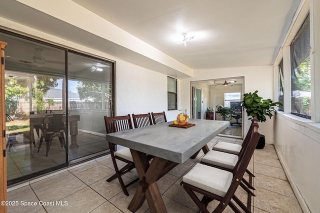 6010 Flamingo Ave, Cocoa, FL 32927 - dining space with ceiling fan, baseboards, and light tile patterned floors