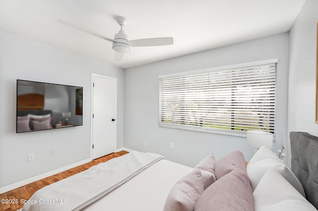 6010 Flamingo Ave, Cocoa, FL 32927 - bedroom featuring wood finished floors, a ceiling fan, and baseboards