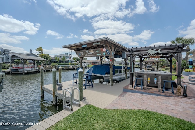 dock area featuring a pergola, boat lift, and a water view