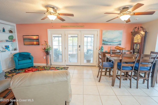 dining room with french doors, a textured ceiling, light tile patterned flooring, built in features, and ceiling fan