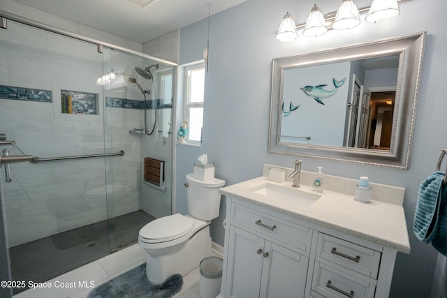 full bathroom featuring a shower stall, toilet, vanity, and tile patterned flooring