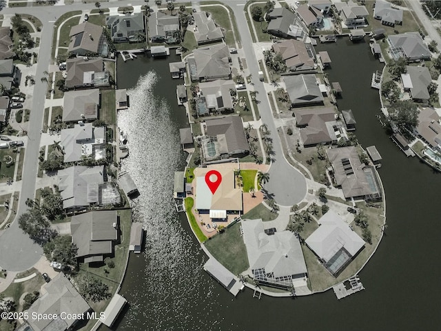 aerial view featuring a residential view and a water view