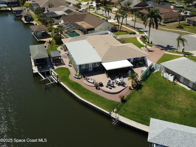 aerial view featuring a water view and a residential view