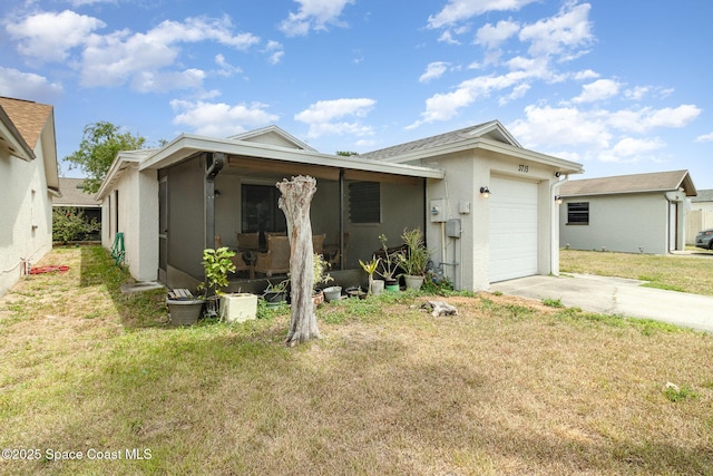 single story home featuring stucco siding, driveway, a front yard, and a garage