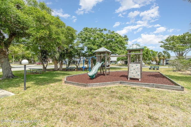 community playground featuring a yard