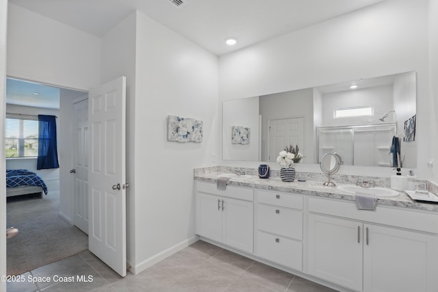 5358 Waterfall Pl, Grant, FL 32949 - bathroom featuring a stall shower, tile patterned flooring, double vanity, and healthy amount of natural light