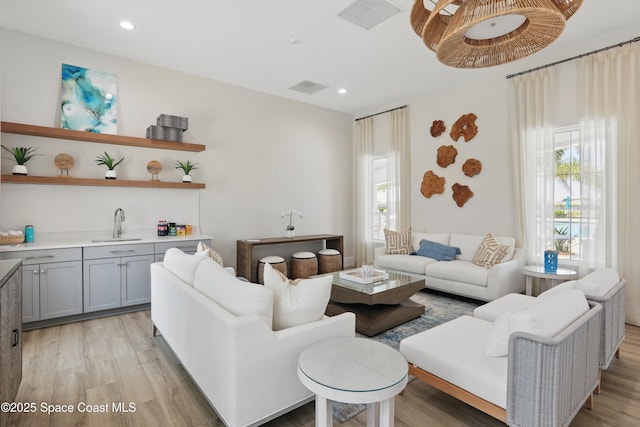 5358 Waterfall Pl, Grant, FL 32949 - living area with plenty of natural light, light wood-style flooring, recessed lighting, and wet bar