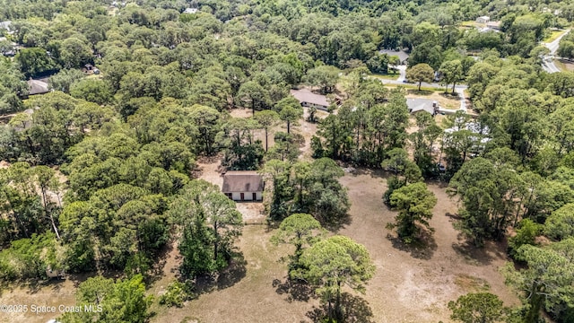 drone / aerial view featuring a view of trees