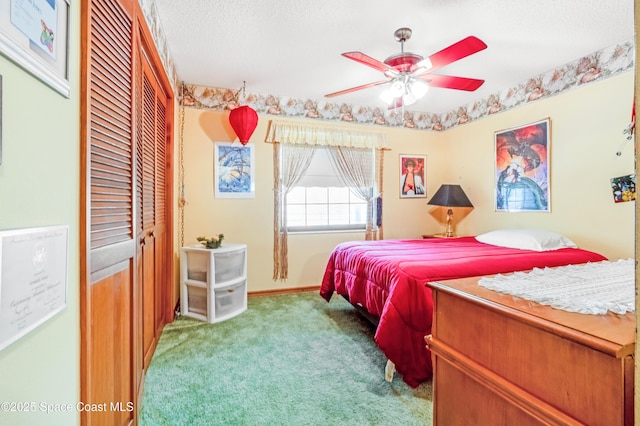 carpeted bedroom featuring a textured ceiling and a closet