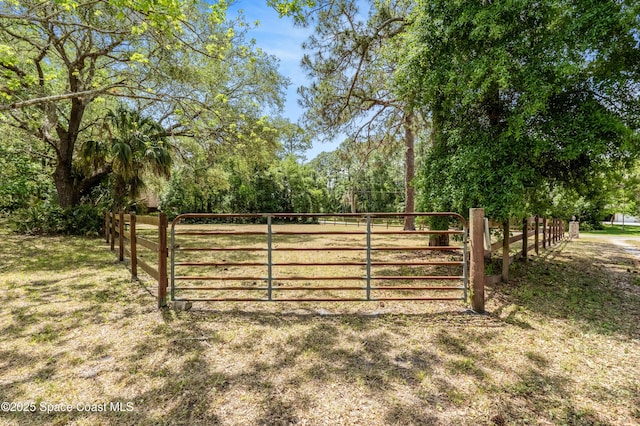view of gate featuring fence