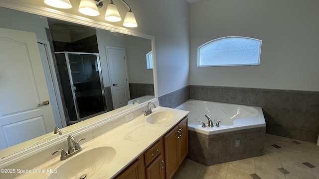 466 Stonehenge Cir, Rockledge, FL 32955 - full bath with double vanity, tile patterned floors, a sink, and a garden tub