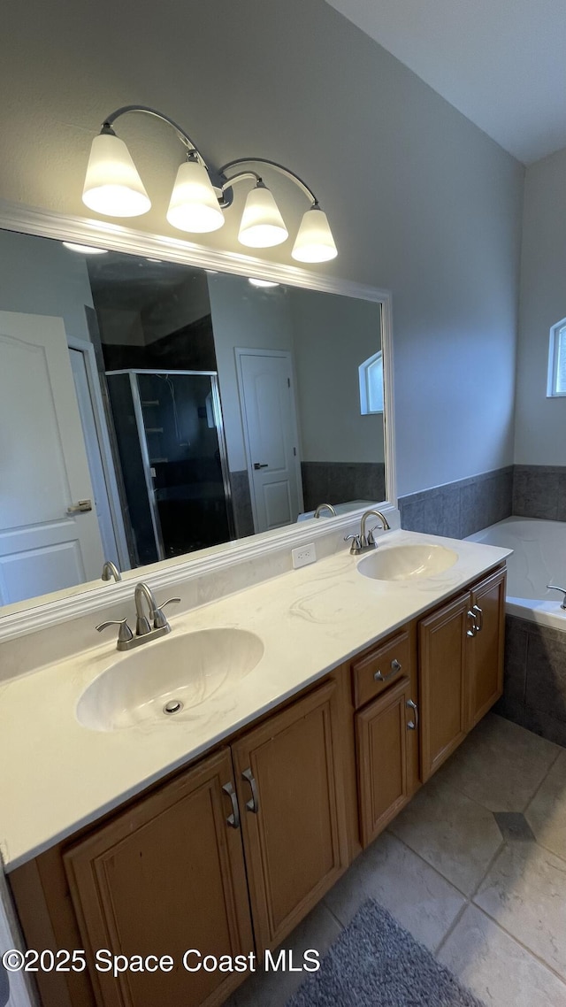 466 Stonehenge Cir, Rockledge, FL 32955 - full bath with tile patterned flooring, a sink, double vanity, and a shower stall