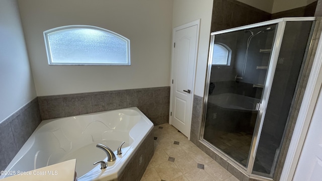 466 Stonehenge Cir, Rockledge, FL 32955 - full bath with tile patterned floors, a shower stall, and a bath