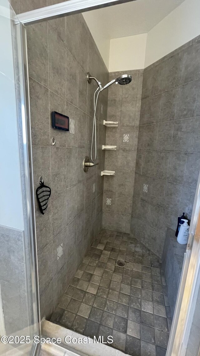 466 Stonehenge Cir, Rockledge, FL 32955 - bathroom featuring a stall shower